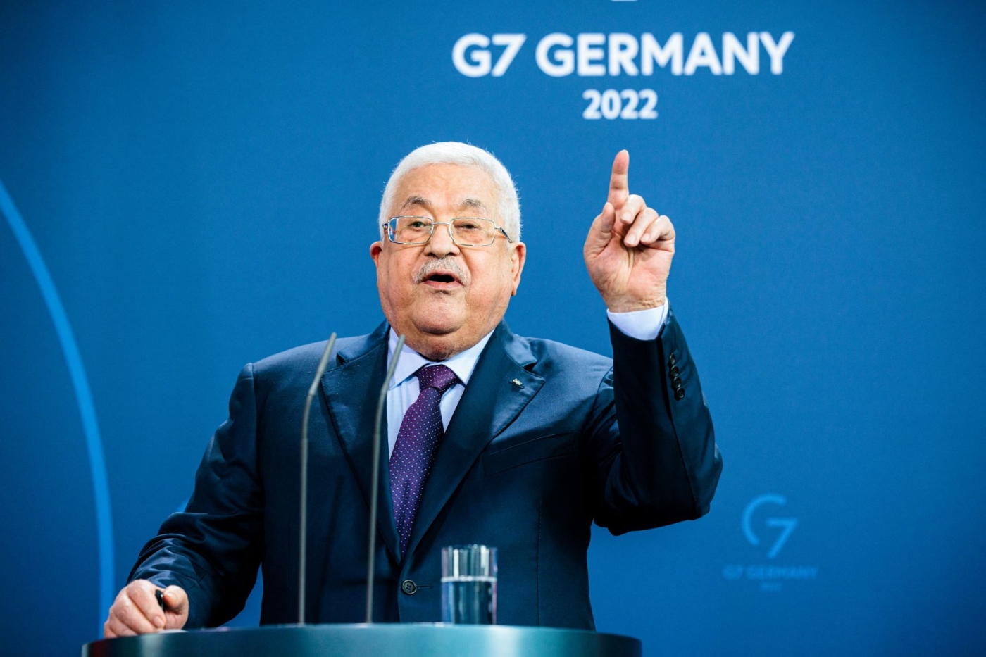 Palestinian president Mahmoud Abbas gesticulates during a joint press conference with the German Chancellor at the Chancellery in Berlin, Germany, on August 16, 2022 (AFP)
