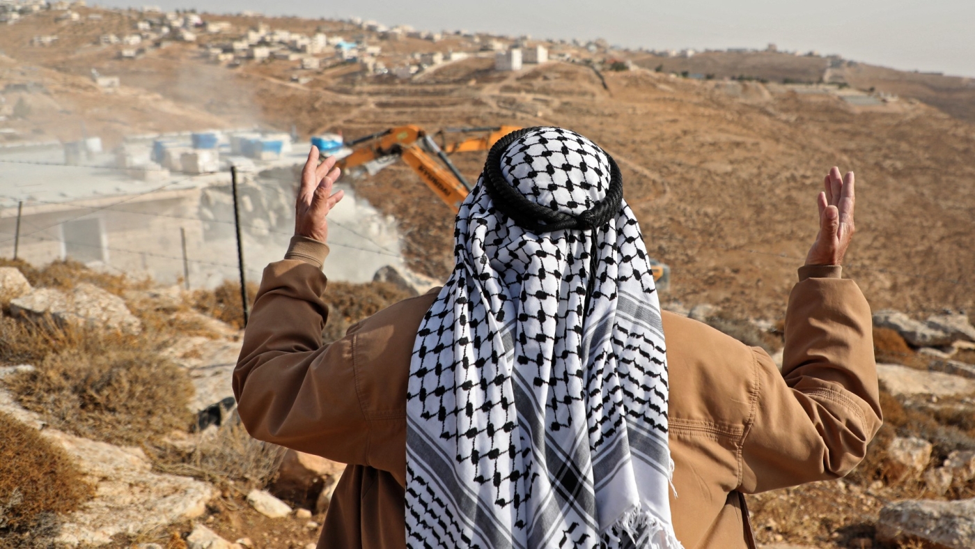 A Palestinian man reacts as Israeli forces demolish his home in the West Bank (AFP/file photo)