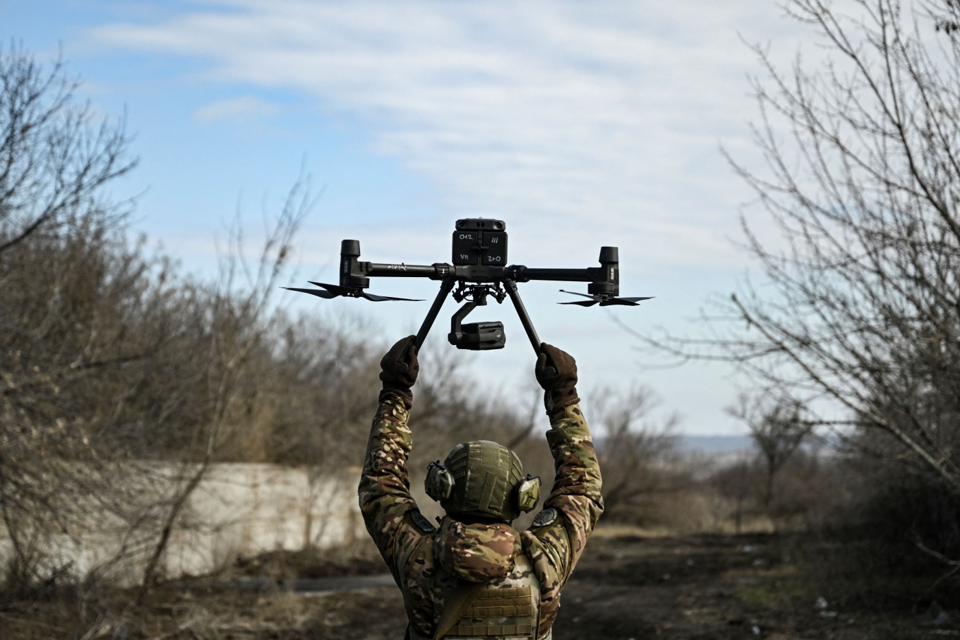 A Ukrainian serviceman flies a drone to spot Russian positions near the city of Bakhmut, in the region of Donbas, on March 5, 2023 (AFP)