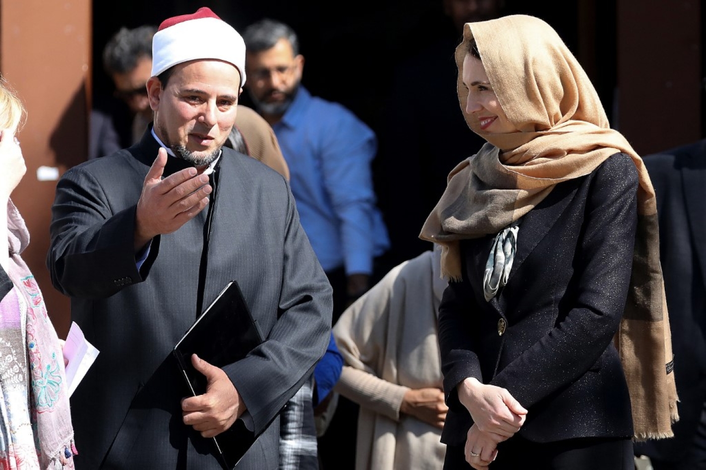 Jacinda Ardern (R) walks with Gamal Fouda (L), the imam of the Al Noor mosque