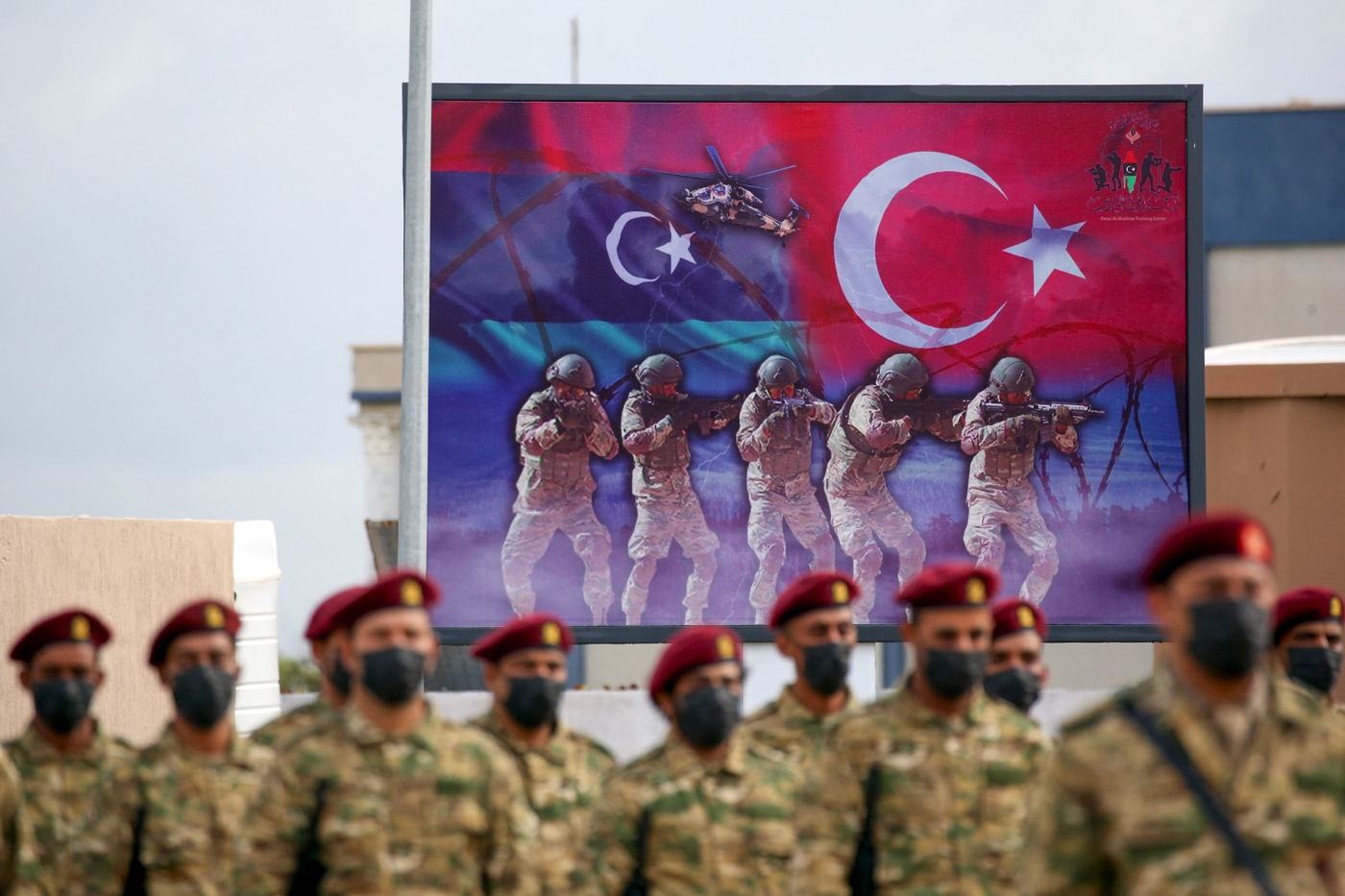 Libyan military graduates loyal to the UN-recognised Government of National Accord (GNA) take part in a parade marking their graduation, a result of a military training agreement with Turkey, at the Omar Mukhtar camp in the city of Tajoura, southeast of the capital Tripoli on 21 November, 2020. (AFP)