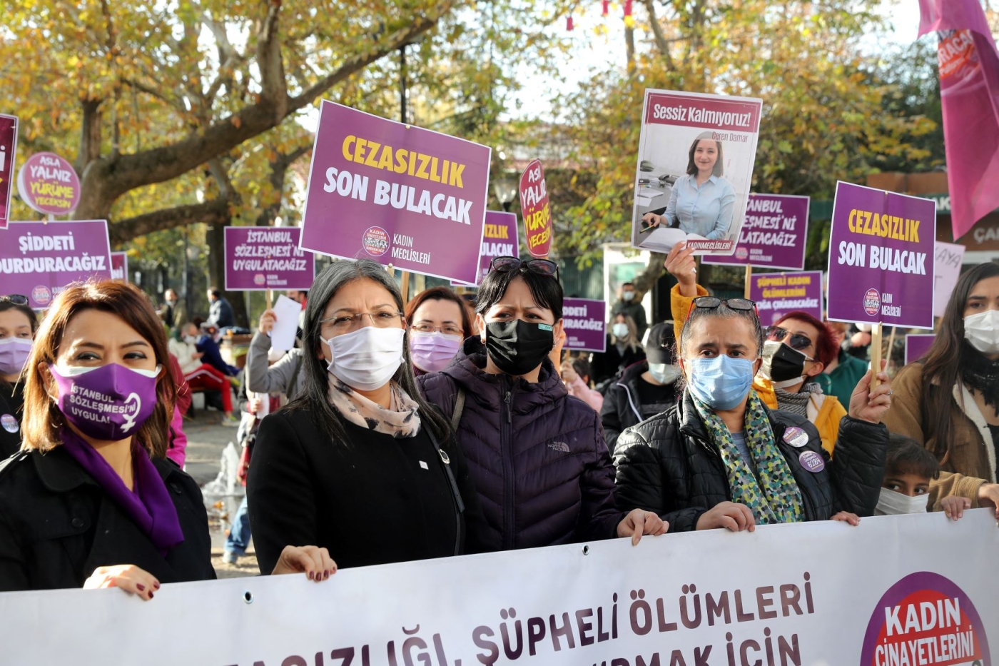 Members of We Will Stop Femicides Platform hold placards reading 'stop femicide' and 'We will enforce the Istanbul convention', during a protest for a better implementation of the Istanbul Convention and the Turkish Law 6284 for protection of the family and prevention of violence against women (AFP)