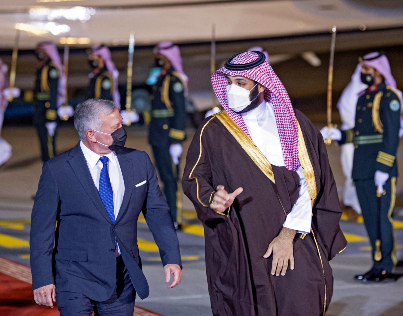 A handout picture provided by the Saudi Royal Palace on March 8, 2021, shows Crown Prince Mohammed bin Salman welcoming Jordan's King Abdullah II (L) upon his arrival in the capital Riyadh (AFP)