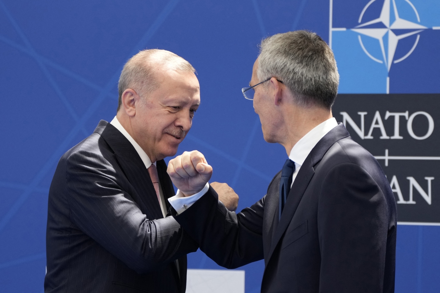 Jens Stoltenberg (R) greets Recep Tayyip Erdogan