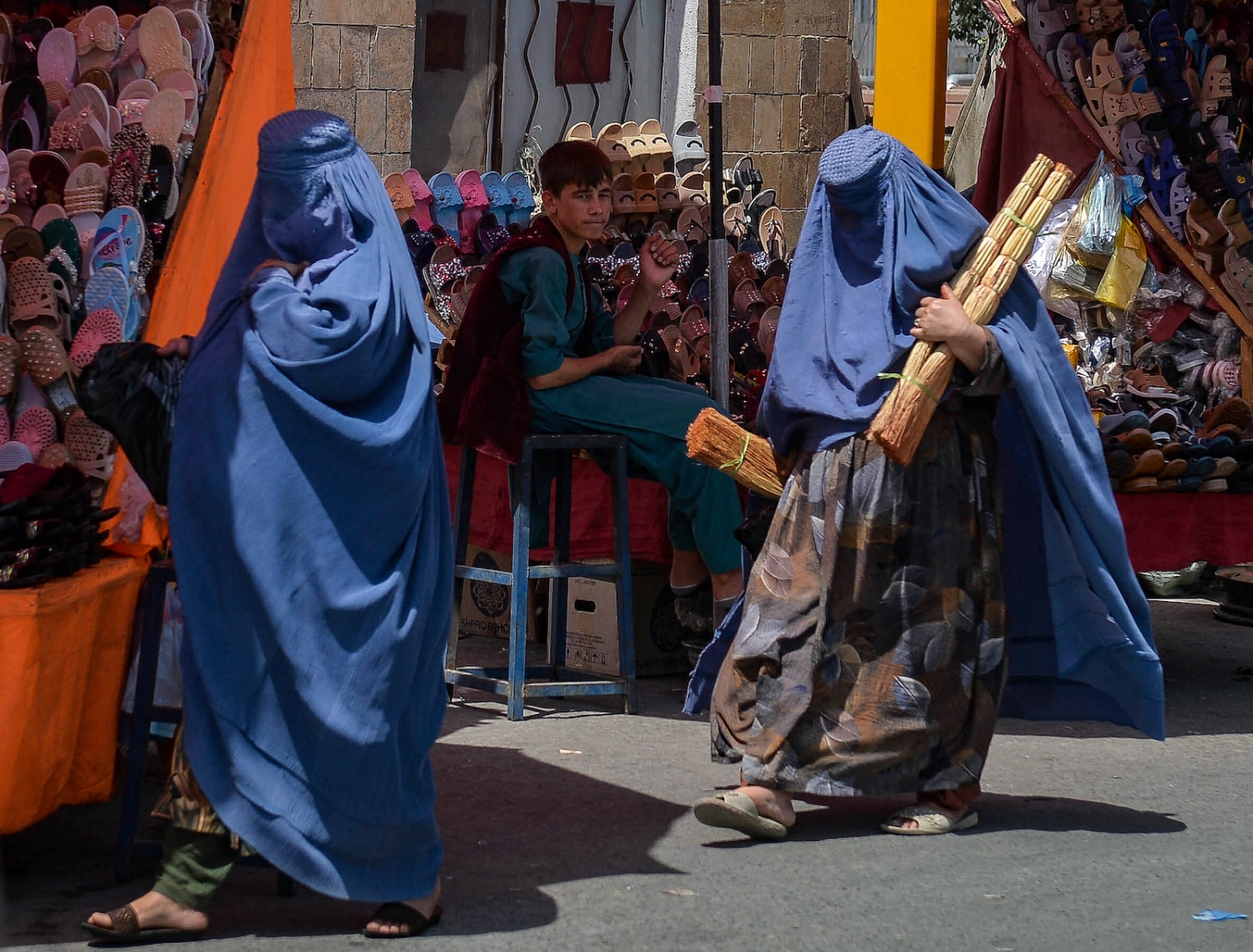 Women in burqa at market in Afghanistan after Taliban seized power