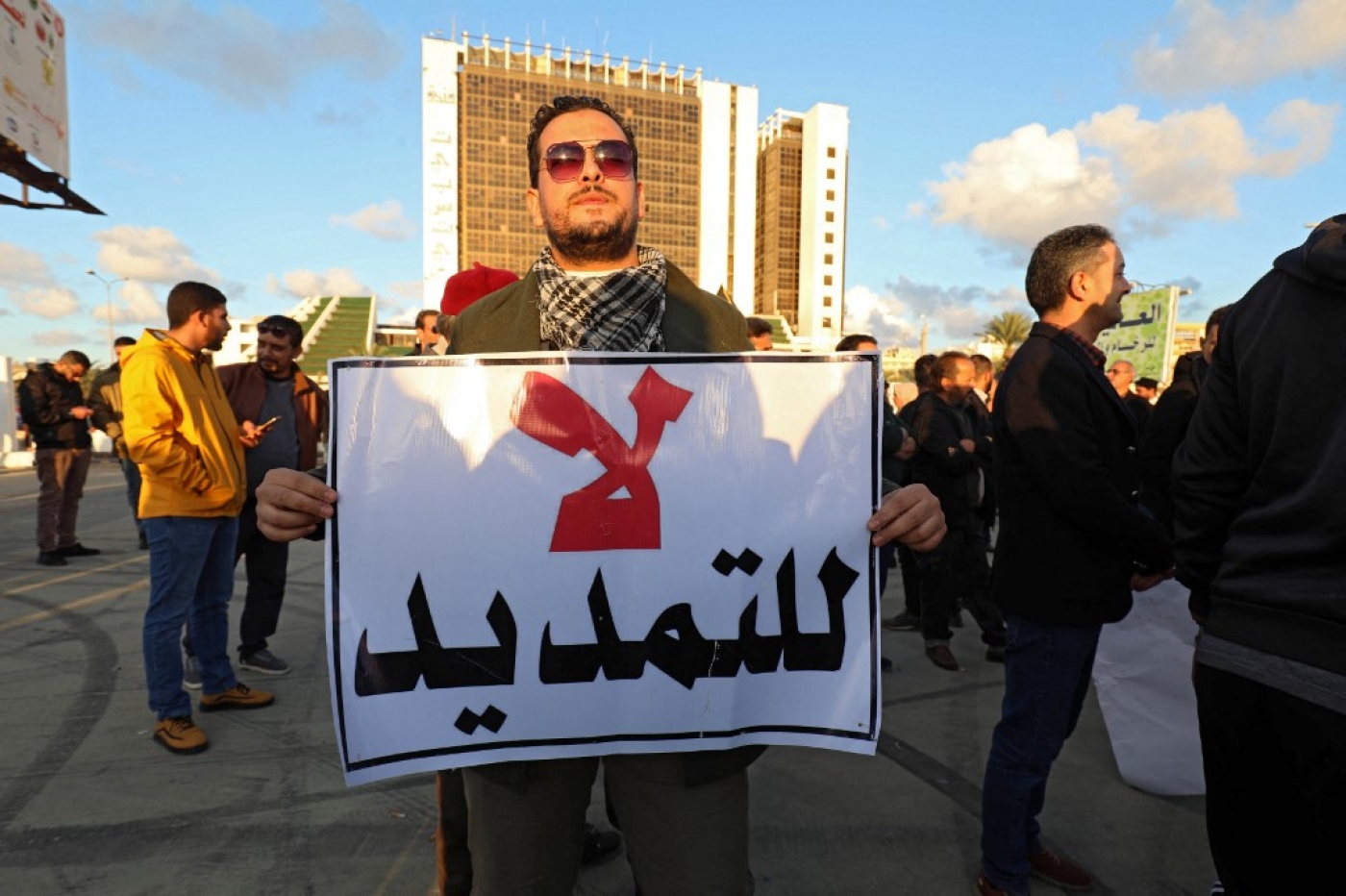 Libyans demonstrate against the postponement of elections, in the city of Benghazi on 24 December 2021 (AFP)
