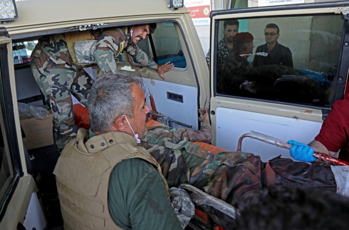 A wounded man is taken to hospital following strikes by Iran on the village of Altun Kupri, in Iraq's Kurdistan region, on 28 September 2022 (AFP)