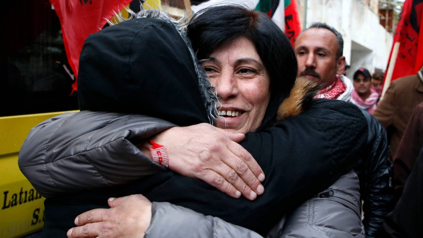 Popular Front for the Liberation of Palestine (PFLP) member Khalida Jarrar hugs a supporter following her release from an Israeli jail, 28 February 2019 (AFP)