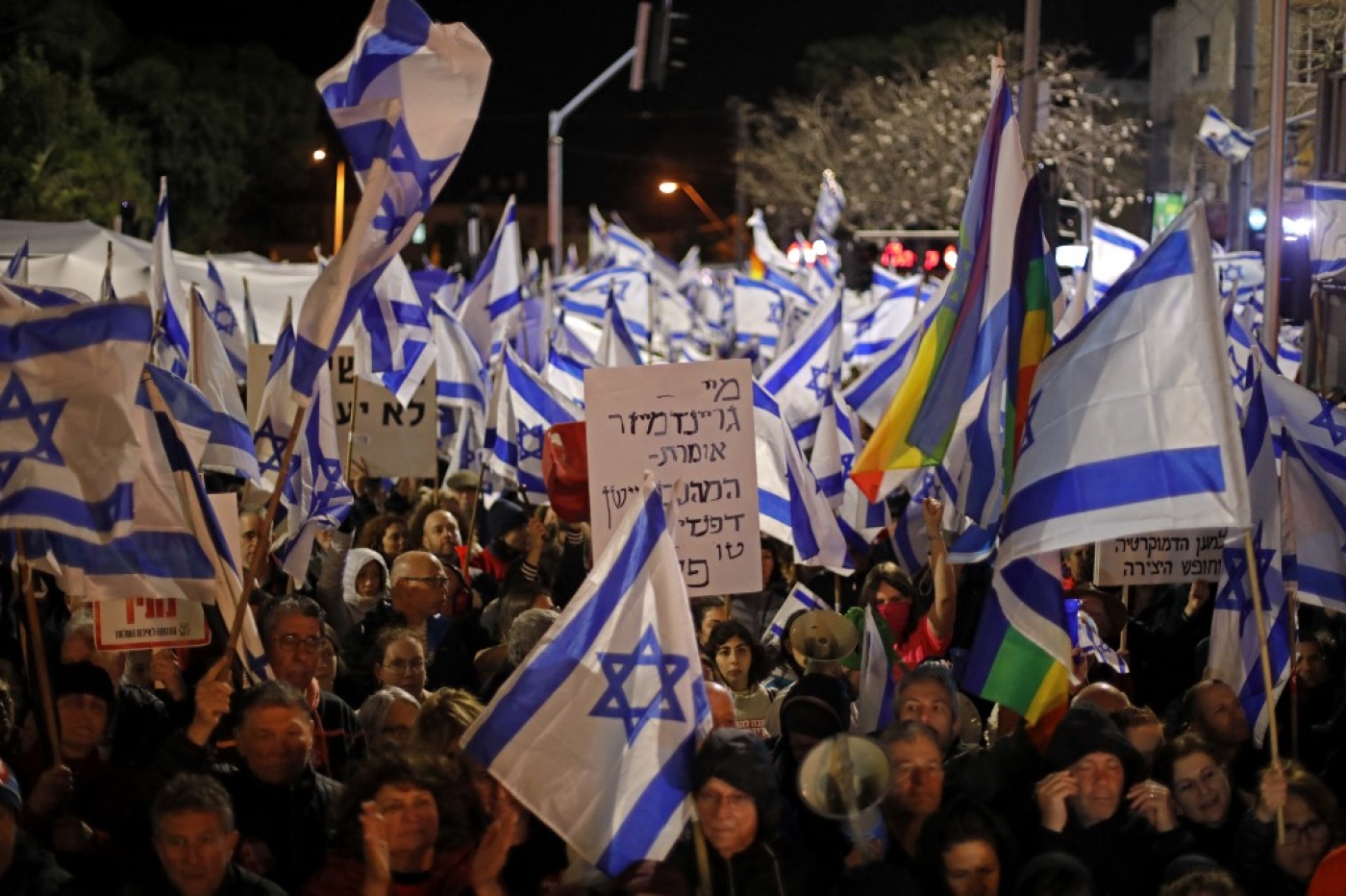 Protesters gather during a rally against the government's controversial judicial overhaul bill in Tel Aviv, Israel, on 18 March 2023 (AFP)