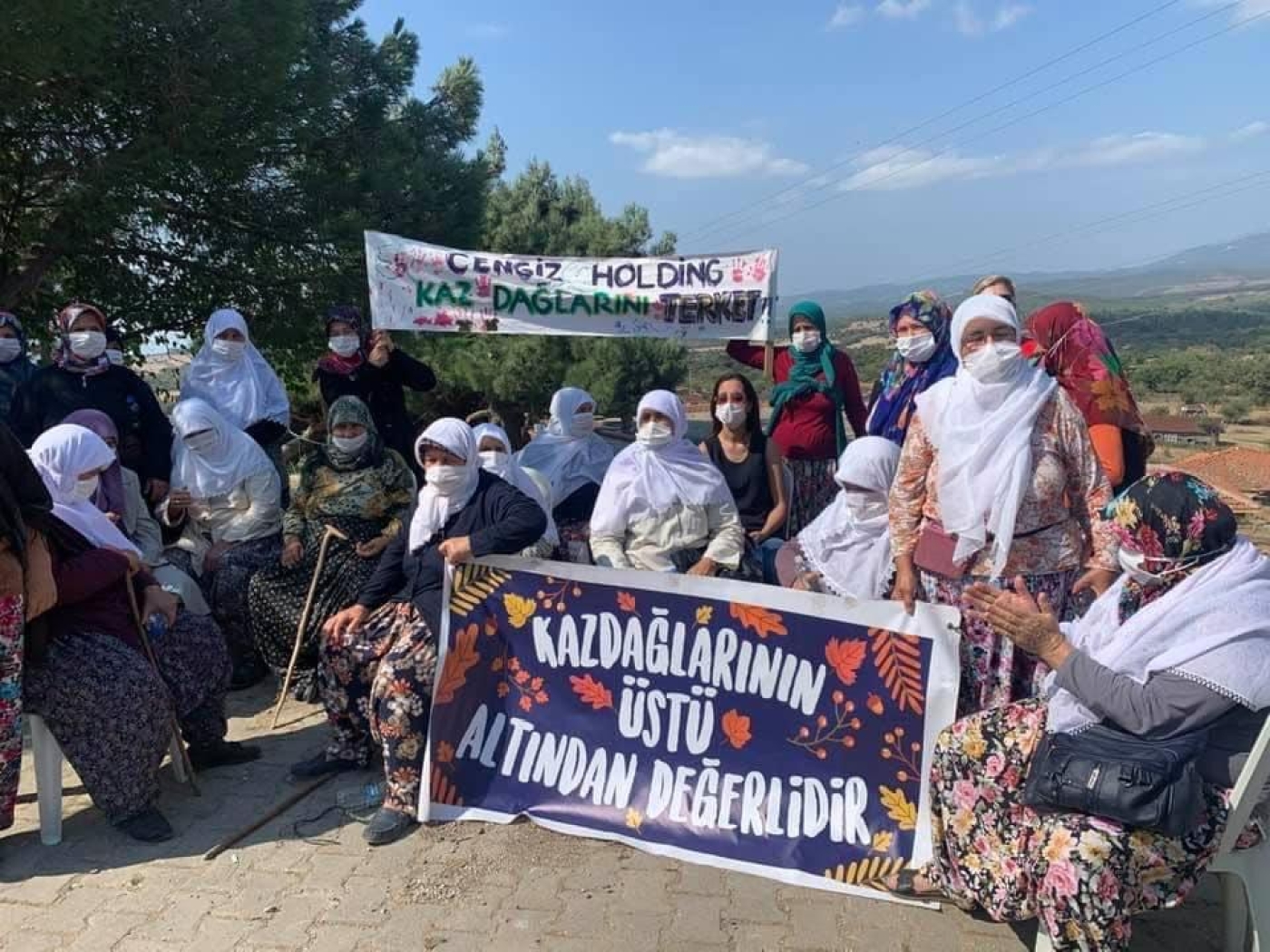 Local activists hold up a banner reading 'Mount Ida is more valuable than gold' as they protest Cengiz Holding (Kazdagi Association)