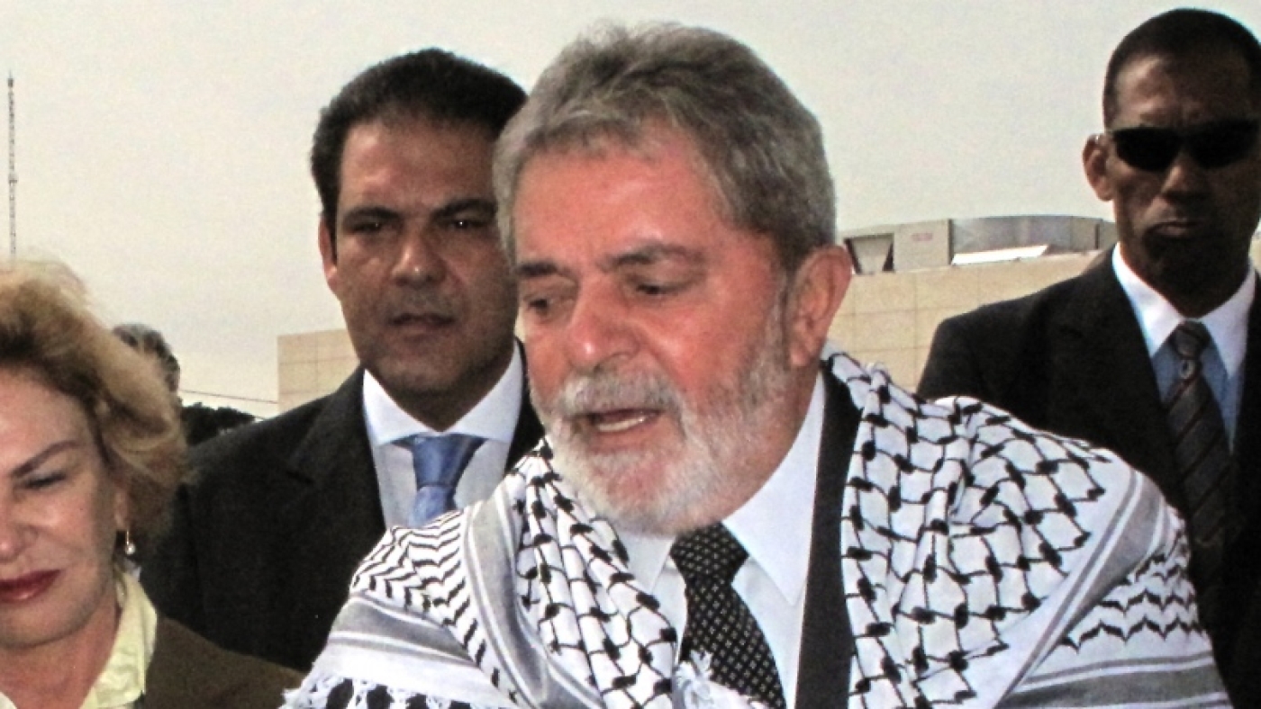 Then-Brazilian president Luiz Inacio Lula da Silva, wearing a Palestinian Kaffiyeh around his shoulders, in the West Bank city of Ramallah for the inauguration of the "Brazil Street" on 17 March 2010.