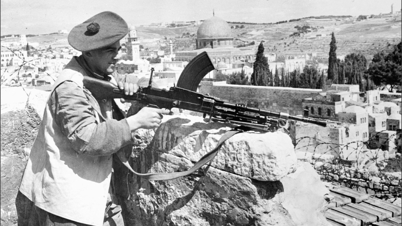 A British soldier holding a British-made Bren machine gun in Jerusalem on 1 May 1948, a few days before the British Mandate in Palestine ended (AFP)