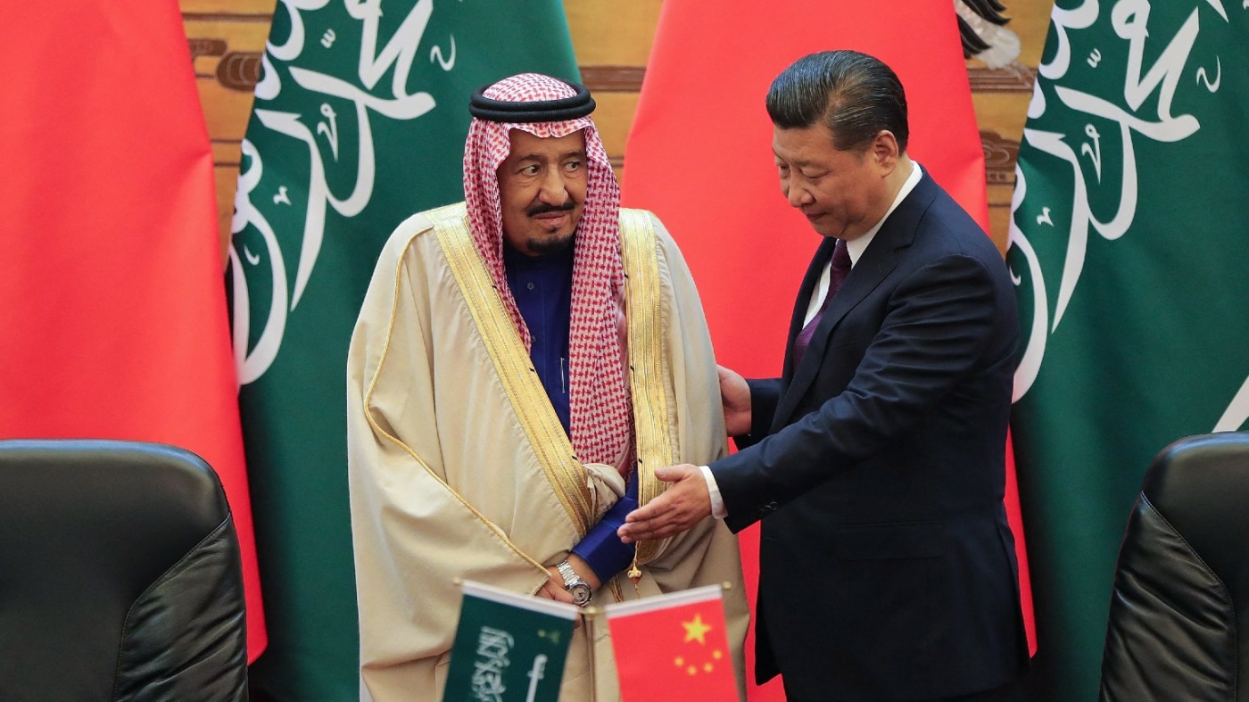 China's President Xi Jinping shakes hands with Saudi King Salman bin Abdulaziz during a signing ceremony in Beijing on 16 March 2017.
