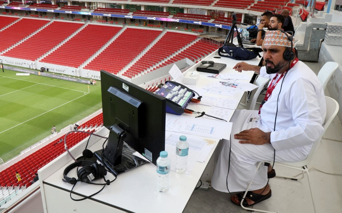 Omani commentator Khalil al-Balushi oversees the Qatar Stars League football match between Al-Gharafa and Al-Ahli  (AFP)