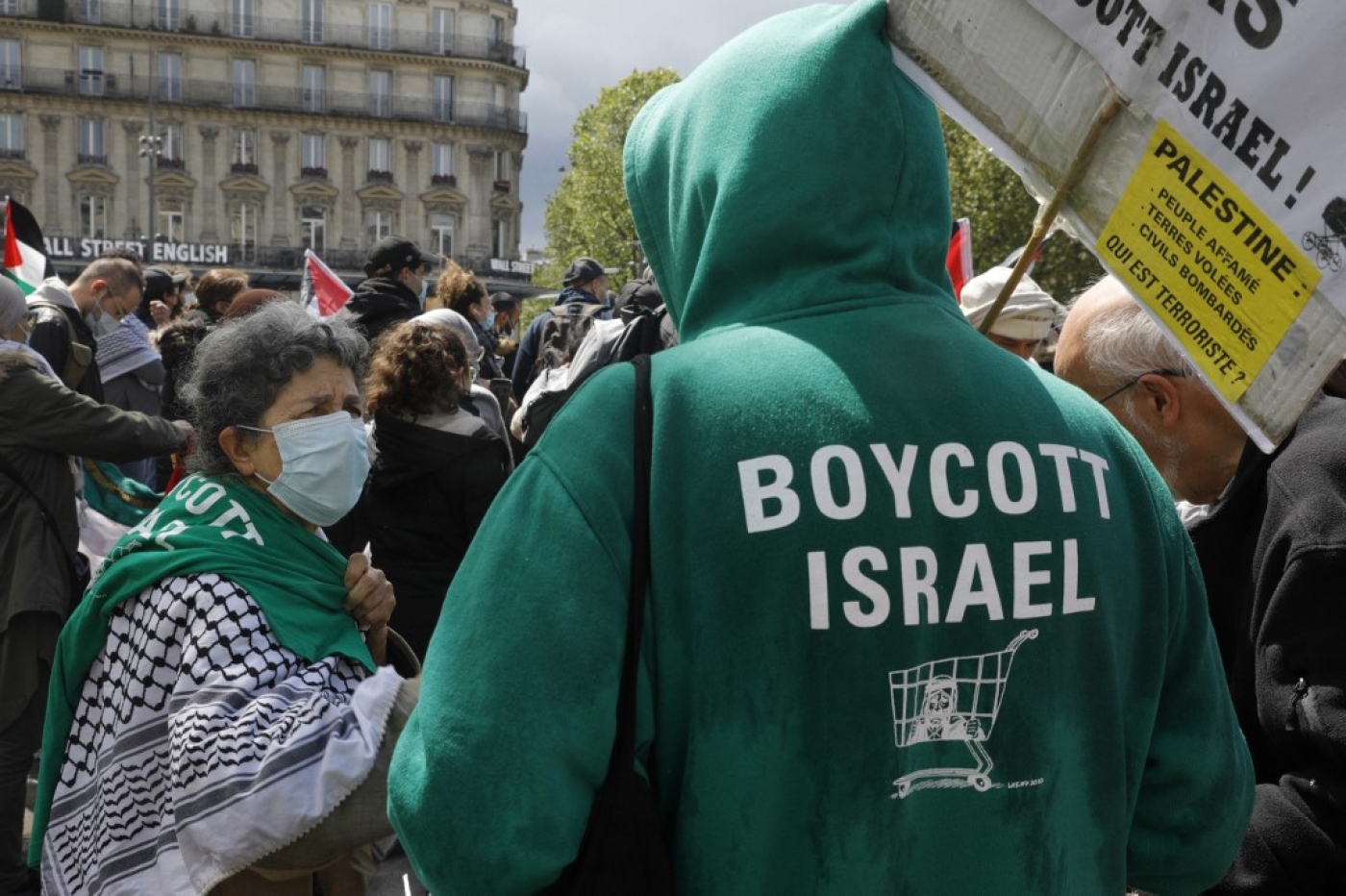 A man wears a hoodie reading "Boycott Israel" at a demonstration in solidarity with the Palestinian people in Paris on 22 May 2021