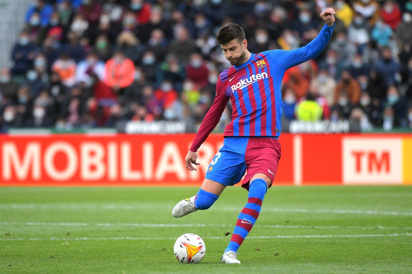 Barcelona's Gerard Pique kicks the ball during a match between Elche CF and FC Barcelona on 6 March 2022 (AFP/File photo)