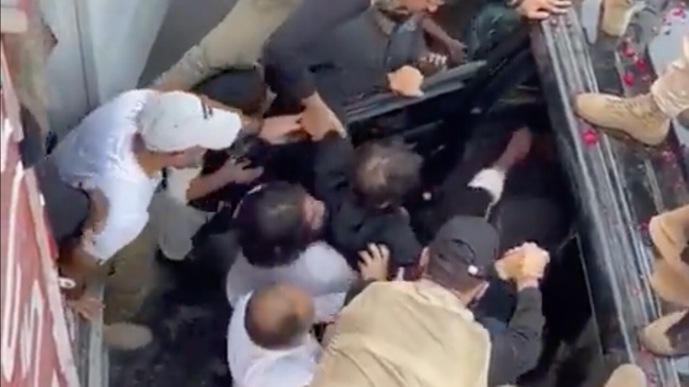 Imran Khan carried by supporters after being shot in the leg in Wazirabad city on 3 November 2022 (Screenshot/Twitter)