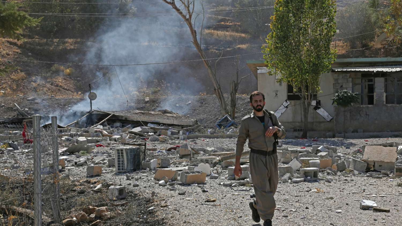 A Kurdish fighter inspects the damage following an Iranian cross-border attack in the area of Zargwez around 15 kilometres from the Iraqi city of Sulaimaniyah on 28 September 2022.