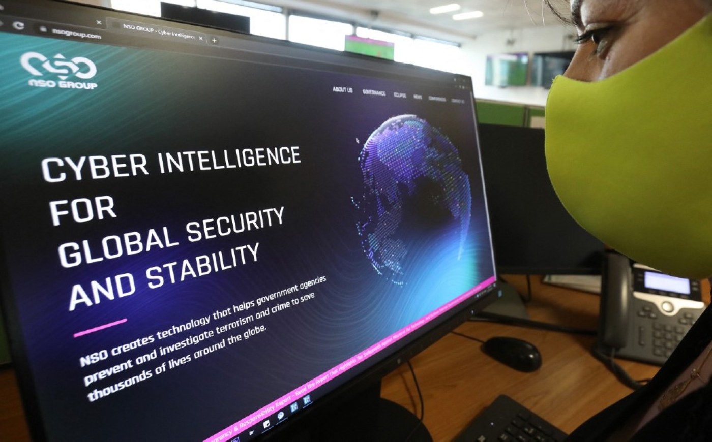 A woman checks the website of Israel-made Pegasus spyware at an office in the Cypriot capital Nicosia on 21 July 2021