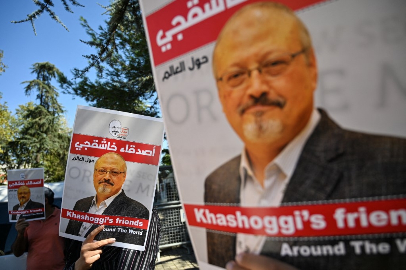Friends of murdered Saudi journalist Jamal Khashoggi hold posters bearing his picture during an event marking the second-year anniversary of his assassination in front of Saudi Arabia Istanbul Consulate, on 2 October 2020.