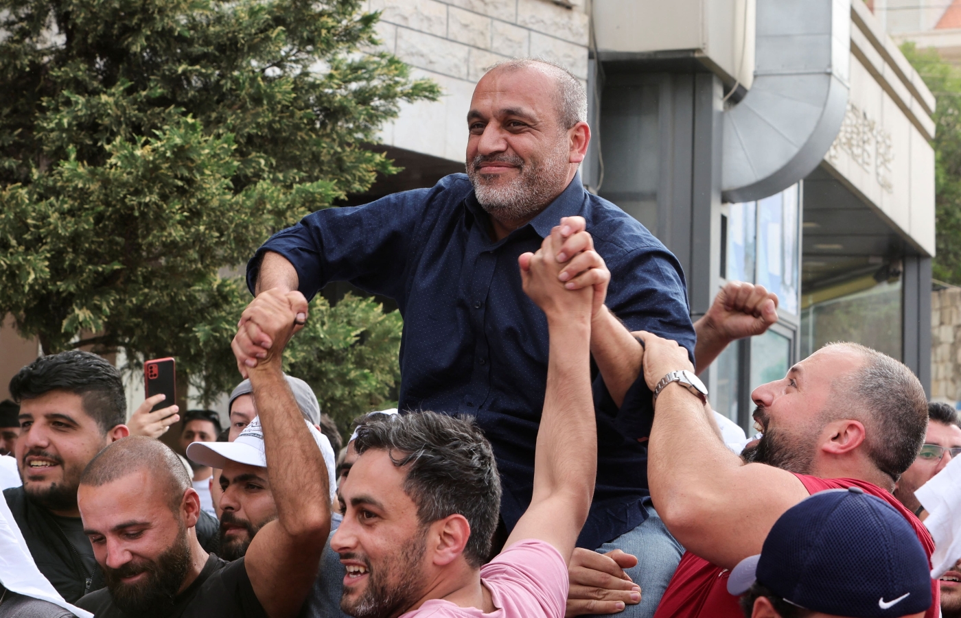 Opposition candidate Yassin Yassin is greeted by his supporters on 16 May 2022, before he was declared winner of a parliamentary seat in Jeb Jennin, West Bekaa, Lebanon (Reuters)