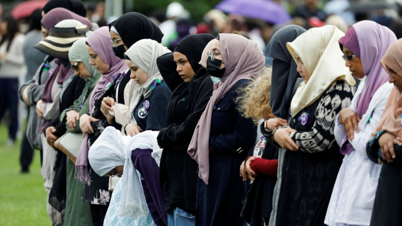 Women pray ahead of an event marking first anniversary of the killing of the Afzaal family in London, Ontario, Canada on 5 June 2022.