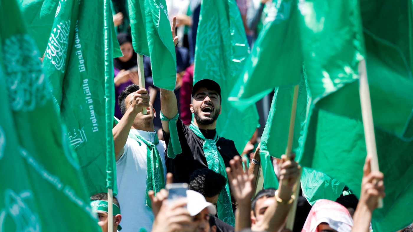 Palestinians take part in a rally celebrating Hamas winning students council election in Birzeit University, near Ramallah, in the Israeli-occupied West Bank on 19 May, 2022 (Reuters)