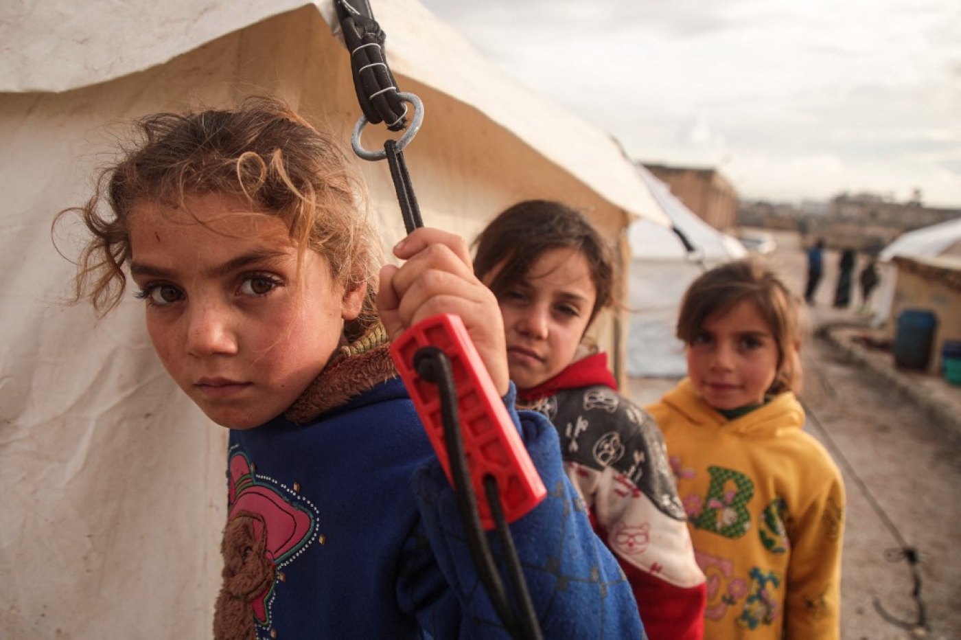 Displaced Syrian children are pictured at a camp near the Turkish border in December 2019 (AFP)