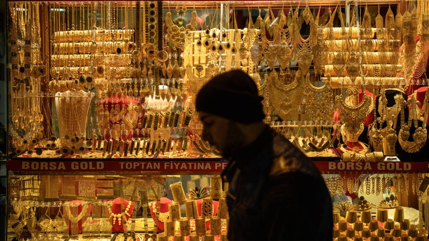 A man passes next to a gold shop at historical grand bazaar in Istanbul.