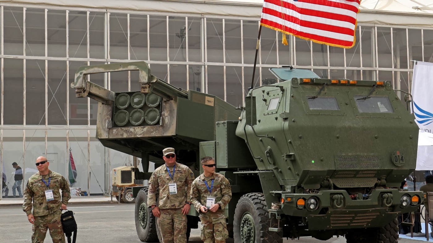 On 6 March 2022, US military personnel stand by a M142 High Mobility Artillery Rocket System (HIMARS) during Saudi Arabia’s first World Defense Show, north of the capital Riyadh.