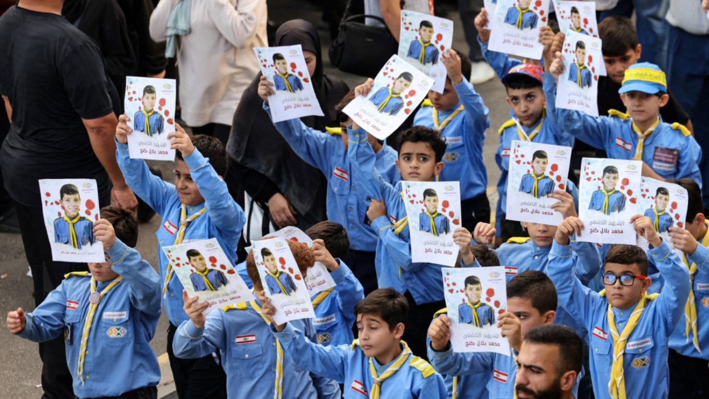 Boy scouts attend the funeral of a fellow scout, killed when hundreds of paging devices exploded across Lebanon the previous day, on 18 September 2024 