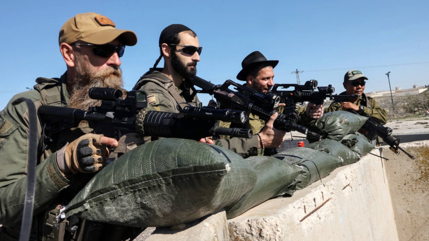 Israeli settlers in the Kiryat Arba settlement on the outskirts of Hebron, West Bank, in January 2024