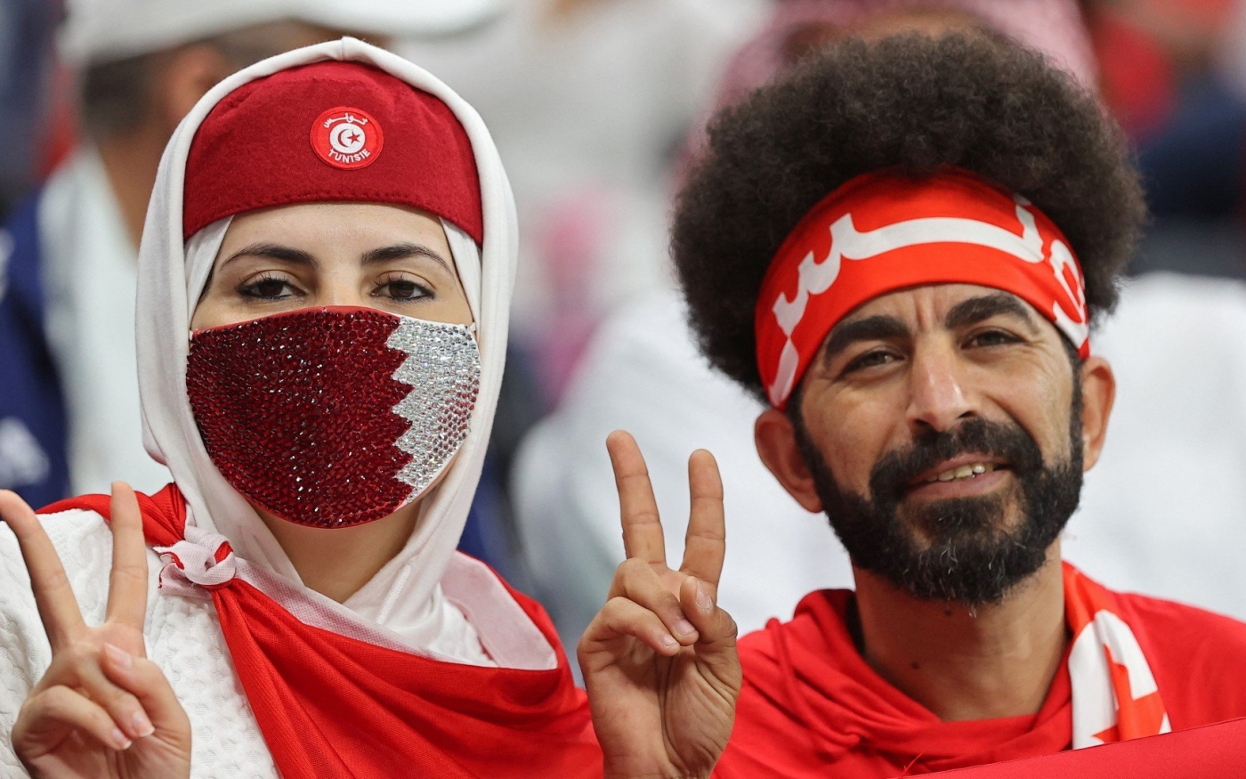Des supporters tunisiens assistent à la finale de la Coupe arabe de la FIFA 2021 contre l’Algérie, le 18 décembre 2021 (AFP)