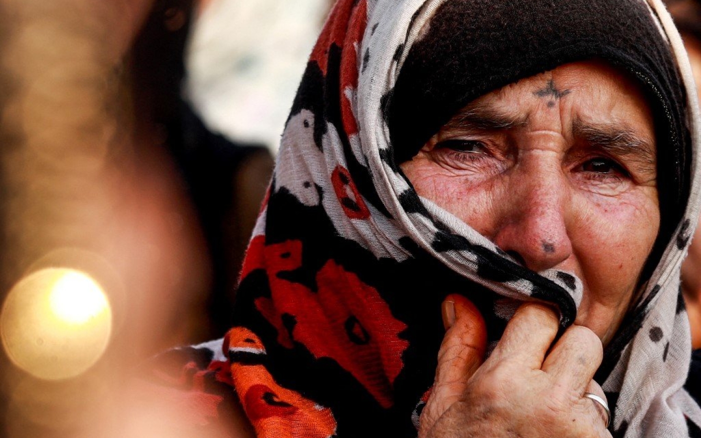 Une Kurde de Syrie, portant des marques sur le visage (AFP)