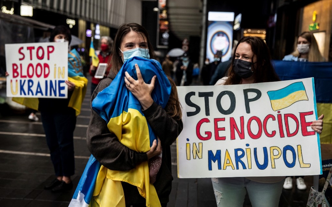 Manifestation à Hong Kong pour marquer le premier mois de l’invasion de l’Ukraine par la Russie, le 24 mars 2022 (AFP/Isaac Lawrence)