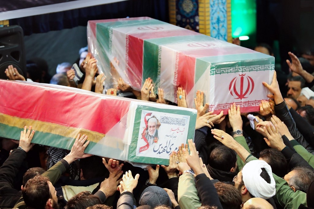 The caskets of Soleimani and Iraqi paramilitary chief Abu Mahdi al-Muhandis were carried through to the front at Tehran University (AFP)