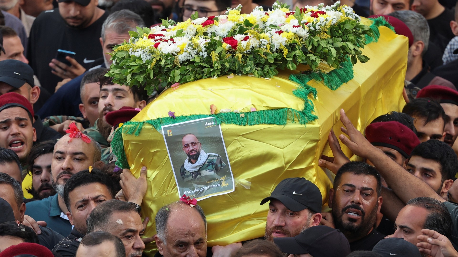 People react around the coffin of Mohammad Mahdi Ammar, son of Hezbollah member of the Lebanese parliament, Ali Ammar, who was killed amid the detonation of pagers across Lebanon, during his funeral in Beirut, Lebanon September 18, 2024. REUTERS/Mohamed Azakir