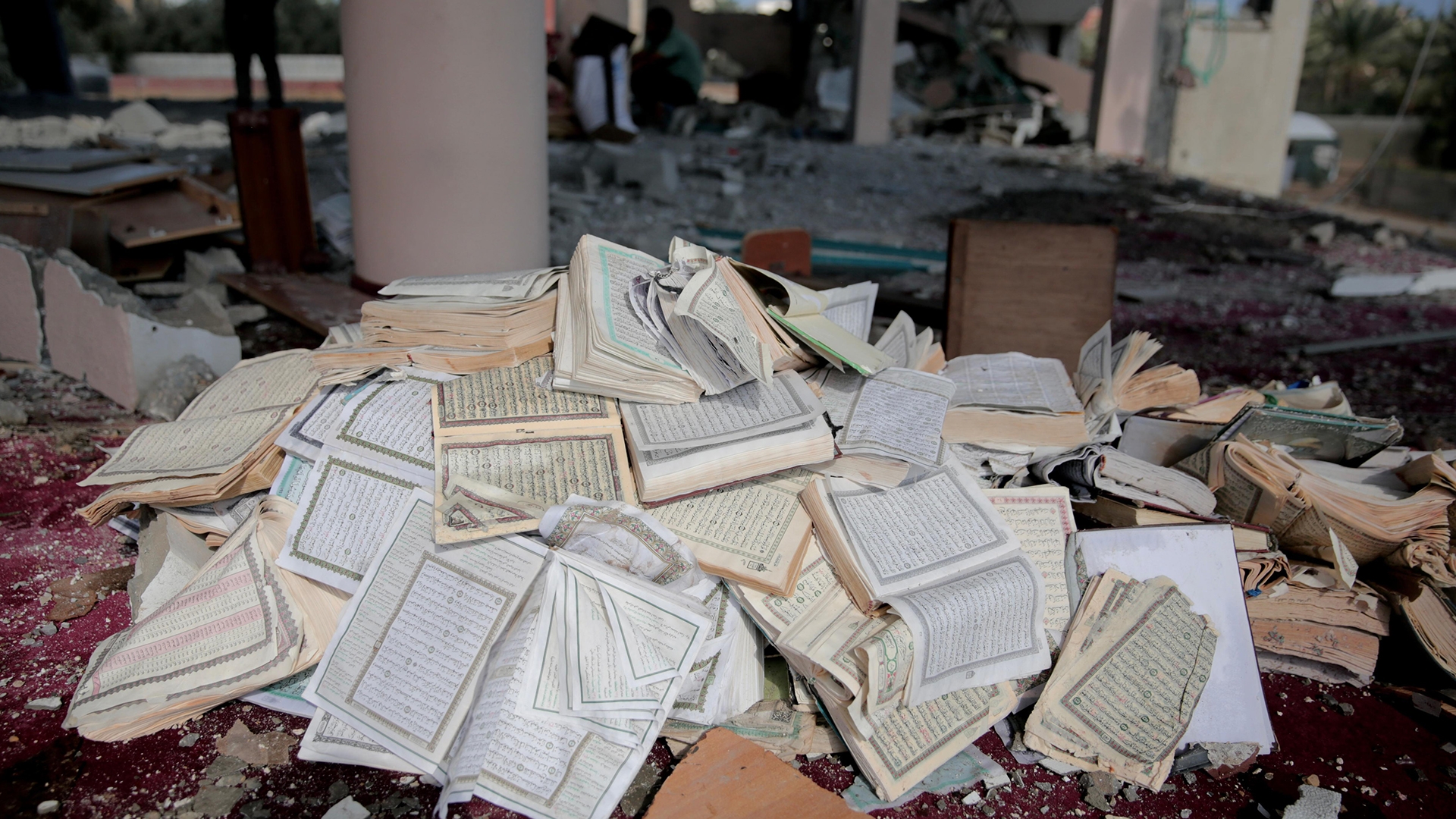 A pile of Quran's lie among the debris of al-Aqsa Mosque in Deir el-Balah, 6 October (MEE/Mohammed al-Hajjar)