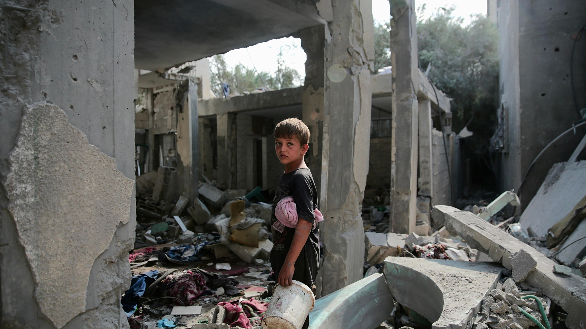 A boy stands amid the rubble of al-Aqsa Mosque in Deir el-Balah, 6 October (MEE/Mohammed al-Hajjar)