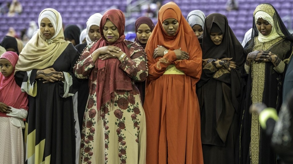 Muslim women pray at the US Bank Stadium during Eid al-Adha worship services and festivities on 21 August 2018 in Minneapolis, Minnesota.