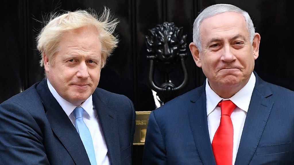 Britain's Prime Minister Boris Johnson (L) greets Israel's Prime Minister Benjamin Netanyahu outside 10 Downing Street in central London on September 5, 2019 (AFP)