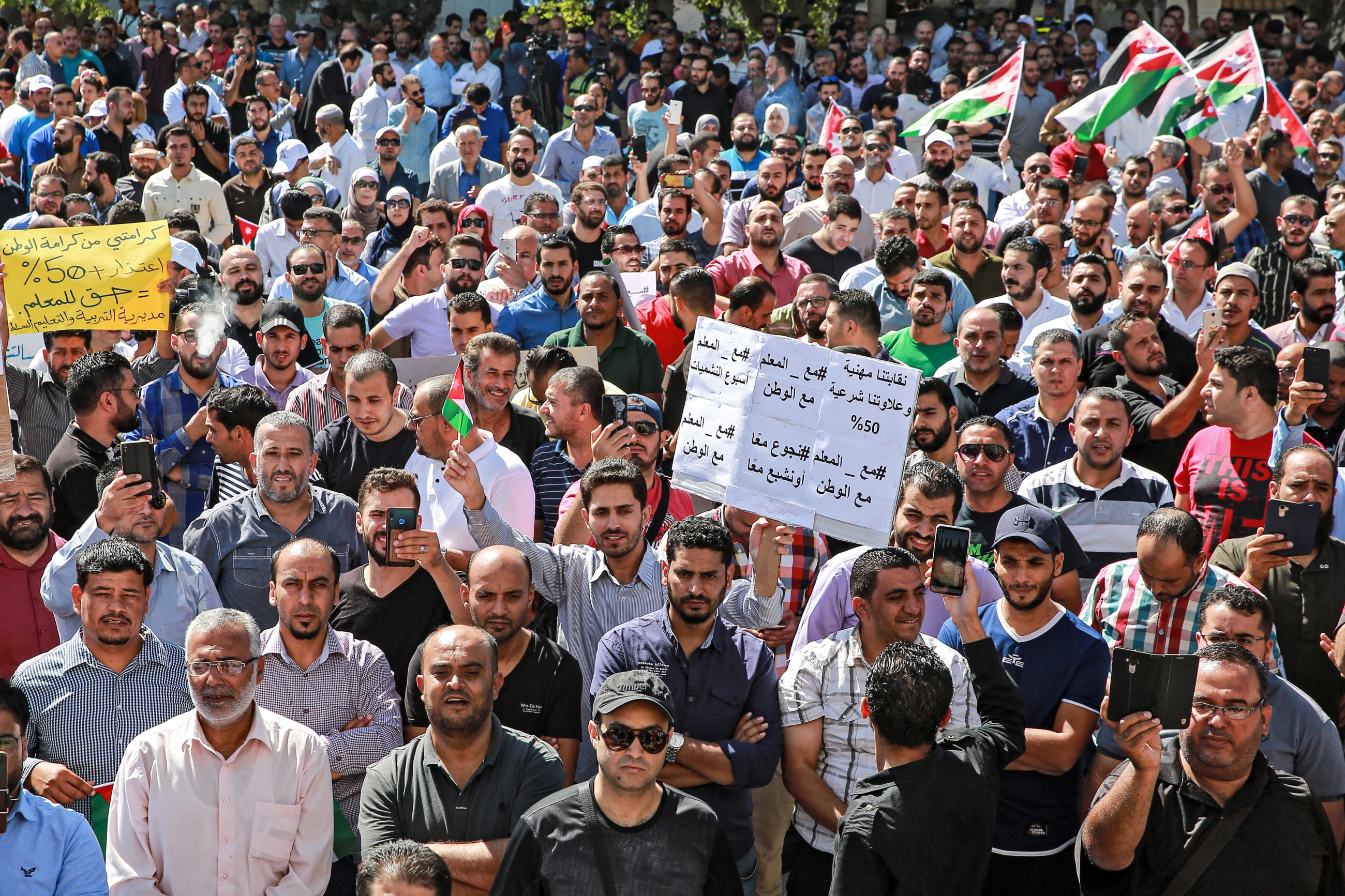 Public school teachers gather for a demonstration demanding pay raises, at the Professional Associations Complex in Jordan's capital Amman on October 3, 2019 (AFP)