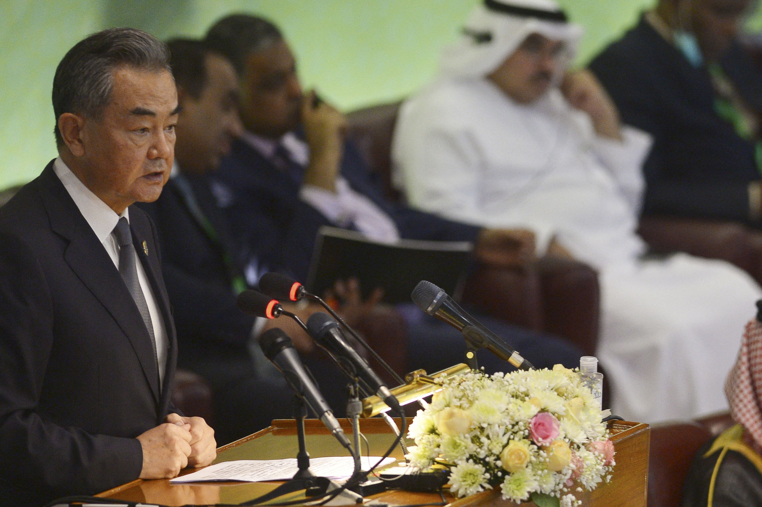 Chinese Foreign Minister Wang Yi speaks in Islamabad during the 48th session of foreign ministers of the Organisation of Islamic Cooperation, on 22 March 2022 (AFP)