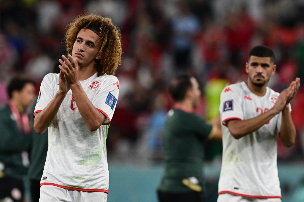 Tunisia's midfielder Hannibal Mejbri applauds after the finale whistle of the Qatar 2022 World Cup Group D football match between Denmark and Tunisia at the Education City Stadium in Al-Rayyan, west of Doha on 22 November 2022 (AFP)