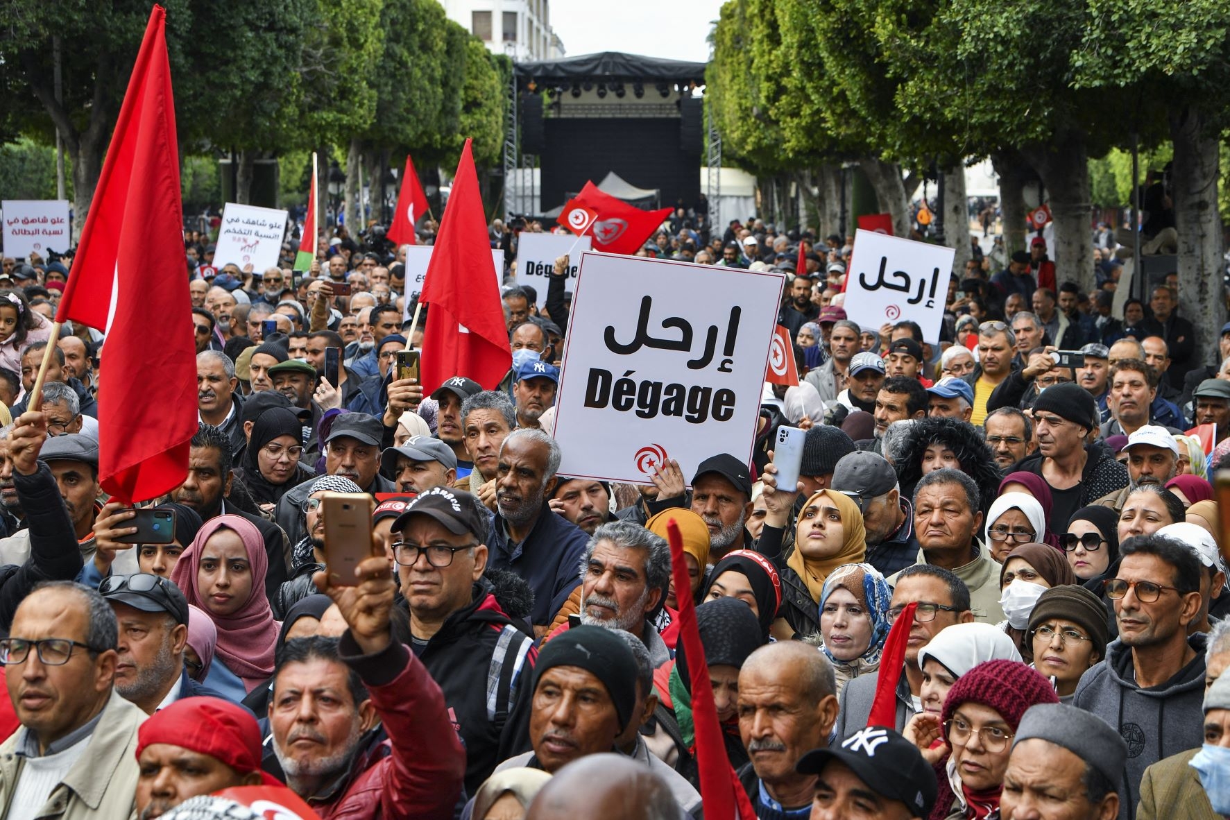 Tunisian demonstrators take part in a rally against President Kais Saied, called for by the opposition "National Salvation Front" coalition, in the capital Tunis, on December 10, 2022 (AFP)