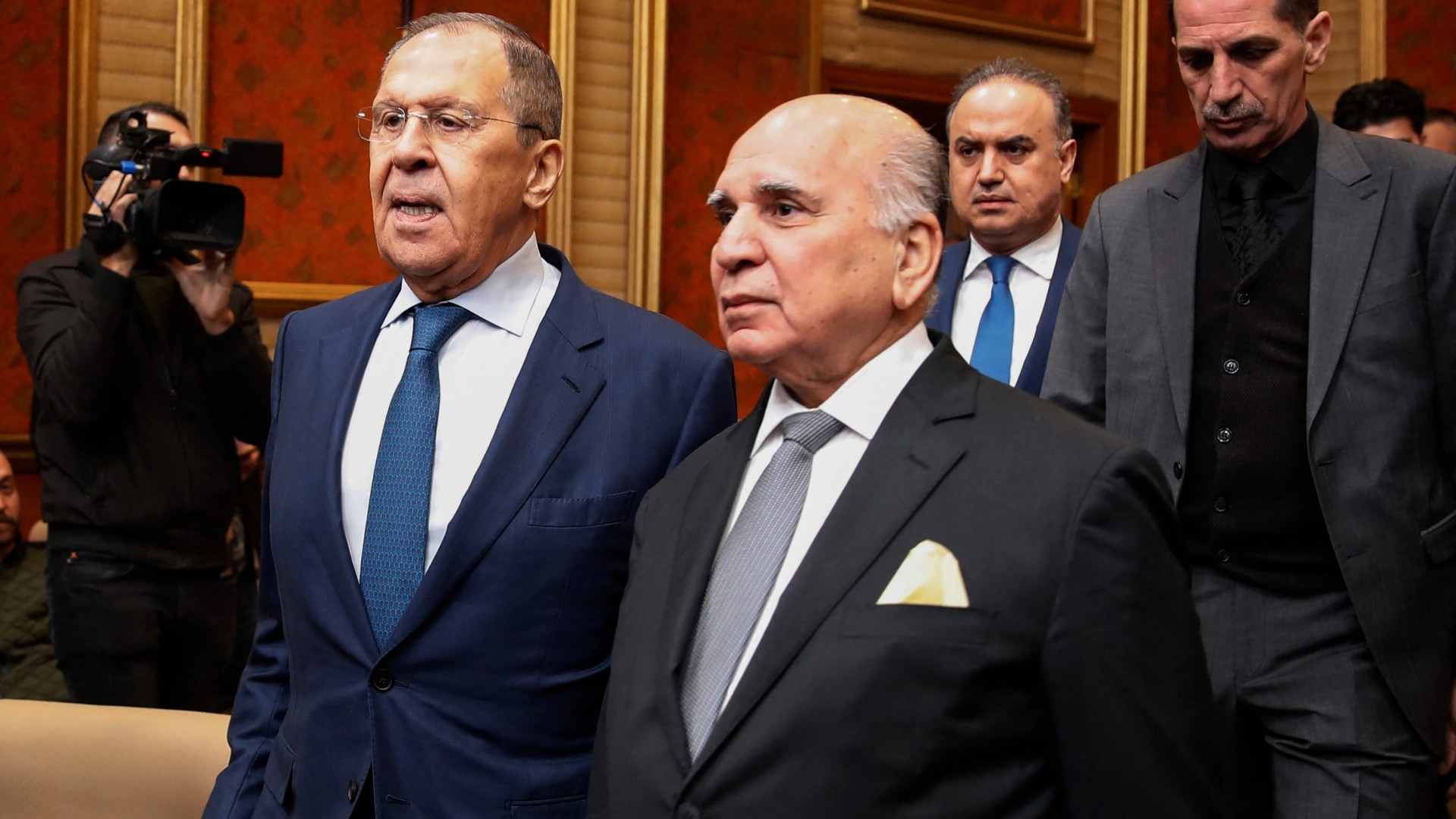 Iraqi Foreign Minister Fuad Hussein and his Russian counterpart Sergei Lavrov arrive to hold a news conference in Baghdad on 6 February (AFP)