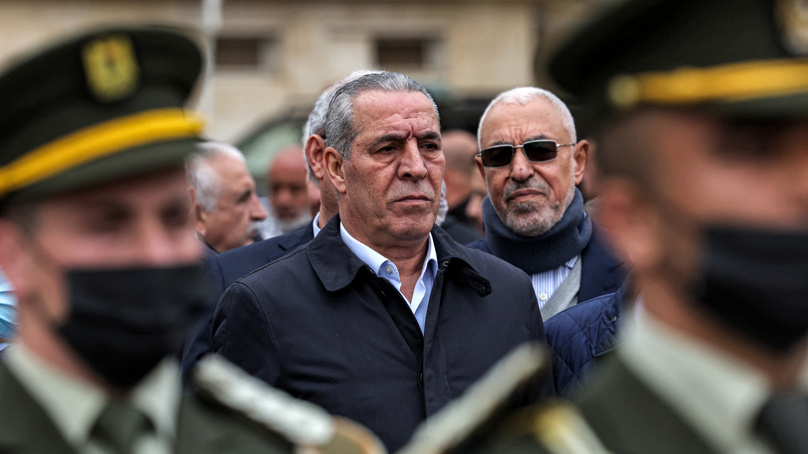 Hussein al-Sheikh attends the funeral of late Palestinian prime minister Ahmad Qorei in the occupied West Bank city of Ramallah on 22 February 2023 (AFP)
