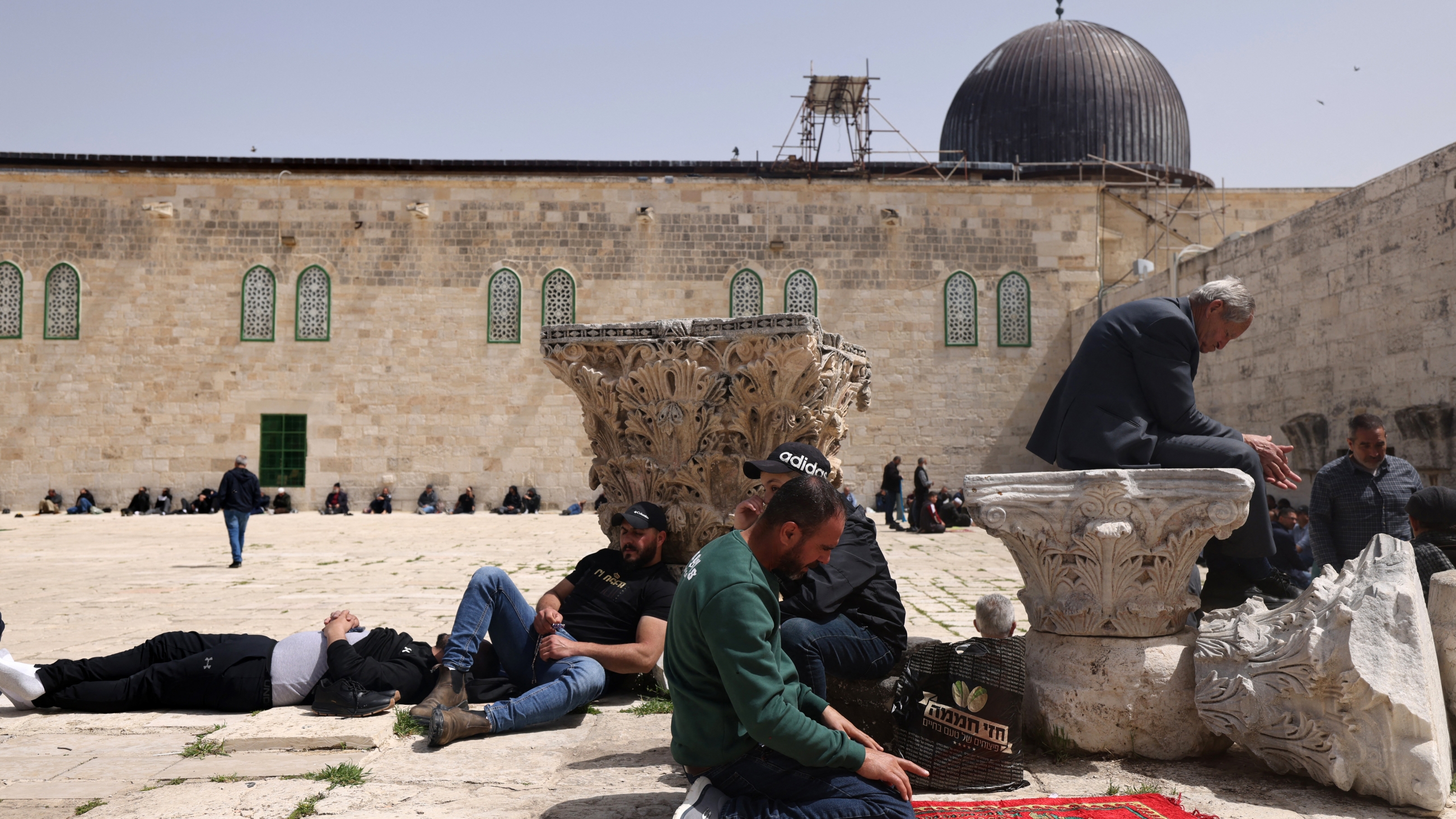 People gather at the Al-Aqsa Mosque in Jerusalem on Friday 24 March 2023. (AFP)