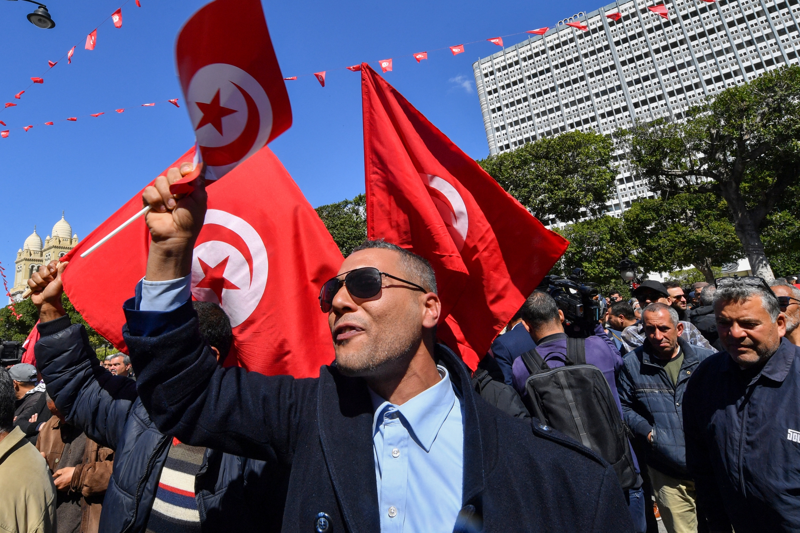 Tunisian demonstrators attend a rally against President Kais Saied