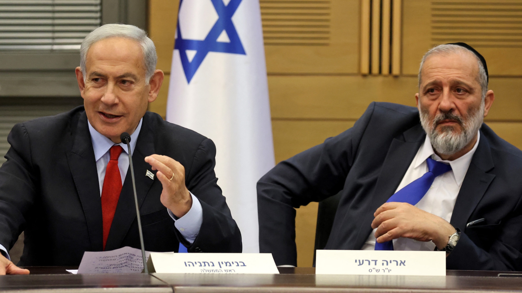 Israeli Prime Minister Benjamin Netanyahu (L) and Aryeh Deri, chairman of the Shas party, at a media briefing on 23 M, 2023, at the parliament in Jerusalem (AFP)